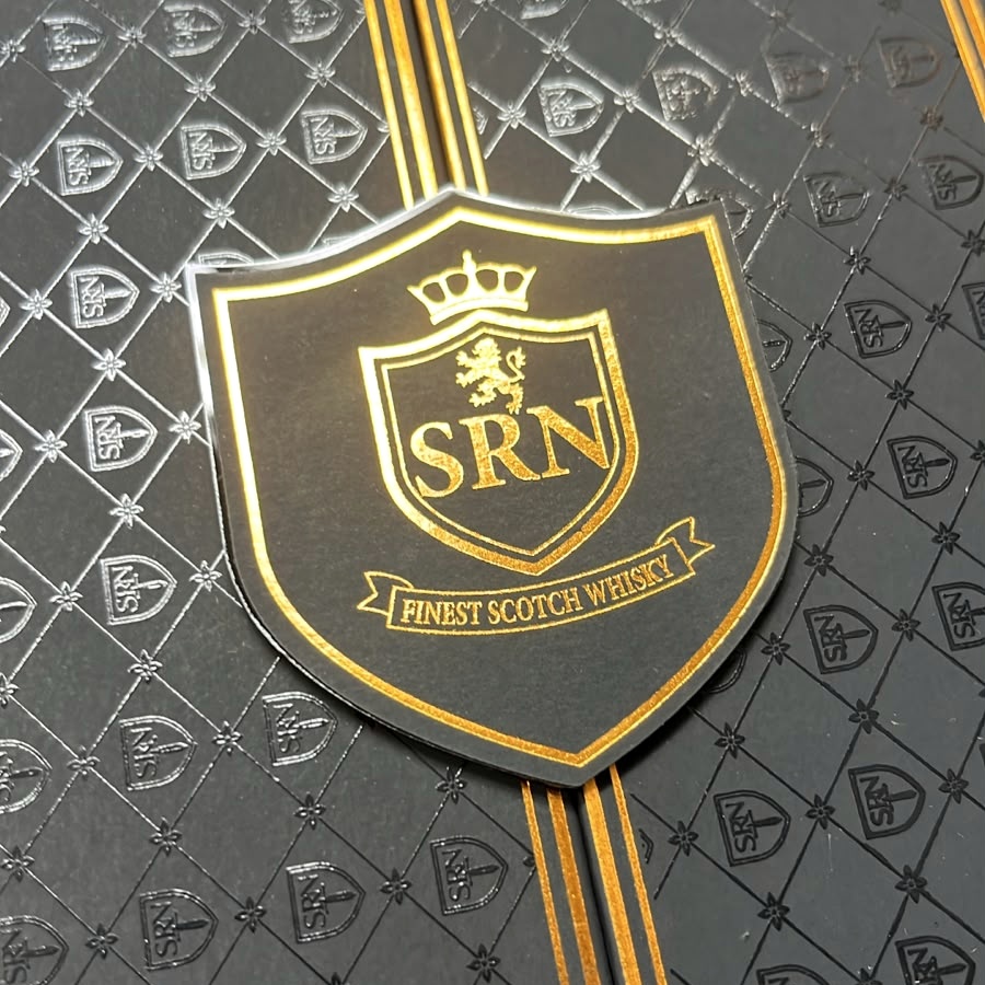 The real raised SRN crest with Finest Scotch Whisky in gold over embossed SRN packaging